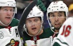 Minnesota Wild's Mikael Granlund, of Finland, second from left, is congratulated by teammates after scoring during the third period of an NHL hockey g