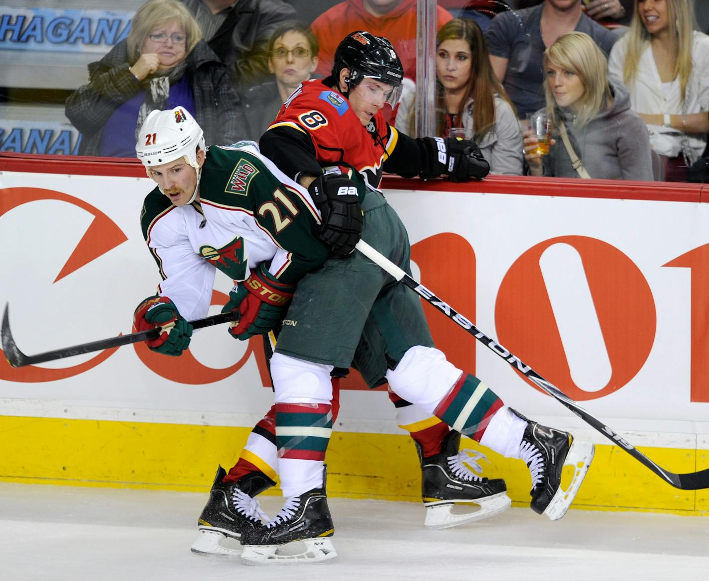 Wild center Kyle Brodziak, left