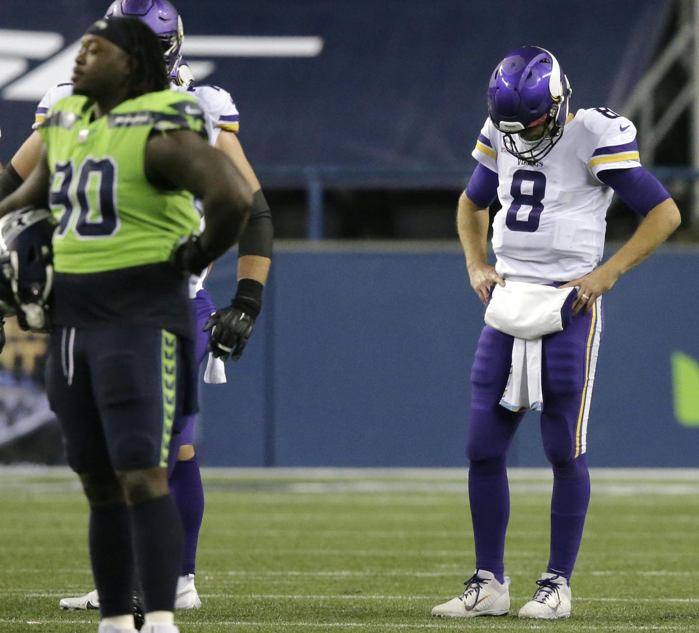 Minnesota Vikings quarterback Kirk Cousins (8) looks down against the Seattle Seahawks as the NFL football game ends, Sunday, Oct. 11, 2020, in Seattle. The Seahawks won 27-26. (AP Photo/John Froschauer)