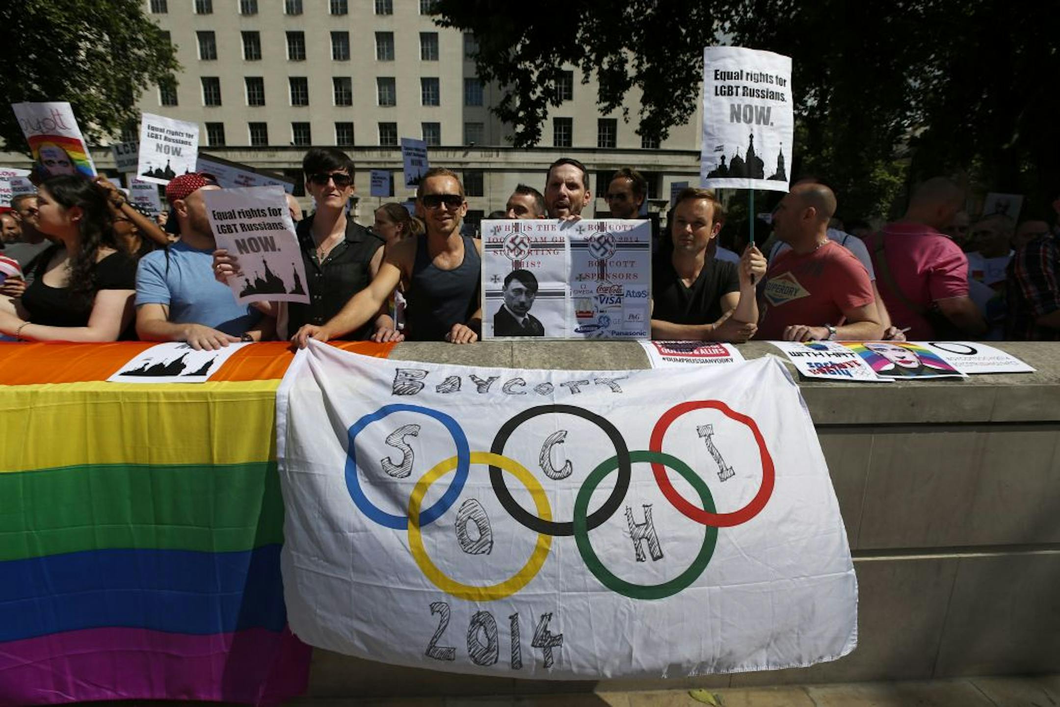 Activists participate at a protest against Russia's new law on gays, in central London, Saturday, Aug. 10, 2013. Hundreds of protesters, called for the Winter 2014 Olympic Games to be taken away from Sochi, Russia, because of a new Russian law that bans "propaganda of nontraditional sexual relations" and imposes fines on those holding gay pride rallies.