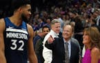 Wolves center Karl-Anthony Towns joked with team owner Glen Taylor and his wife after a 2019 game.