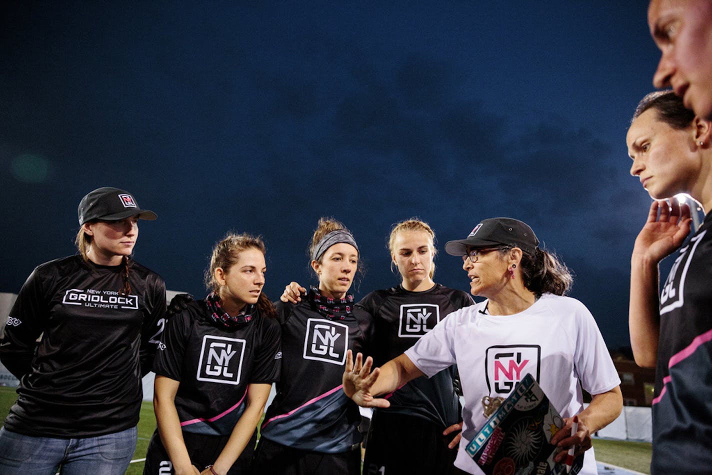 Ultimate Frisbee team the New York Gridlock huddle with their coach during a competition at at Columbia University in Manhattan.