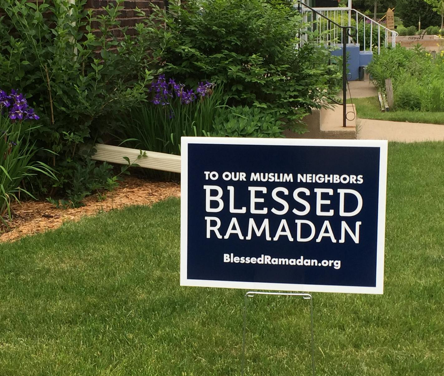 727804 is ID. Caption: Yard signs are new campaign to support Muslims.