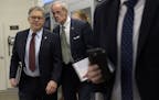 Sen. Al Franken, with Delaware Sen. Thomas Carper, headed to a luncheon with fellow Democrats on Capitol Hill on Tuesday.