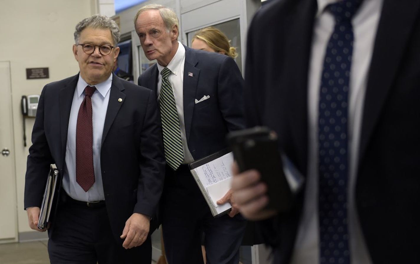 Sen. Al Franken, with Delaware Sen. Thomas Carper, headed to a luncheon with fellow Democrats on Capitol Hill on Tuesday.