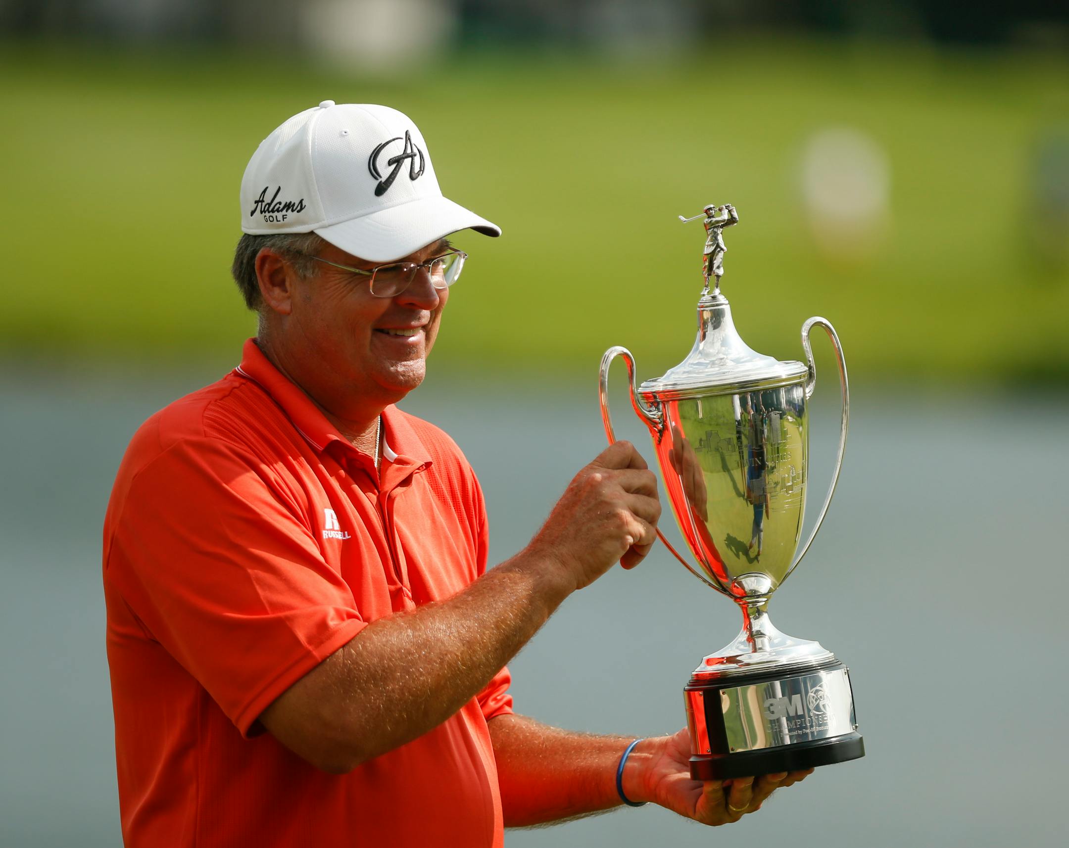Kenny Perry held the trophy after his win Sunday afternoon at the TPC in Blaine. ] JEFF WHEELER • jeff.wheeler@startribune.com The 3M Championship concluded on Sunday afternoon with Kenny Perry winning by a stroke over a Bernhard Langer at the Tournament Players Club Twin Cities in Blaine August 3, 2014.