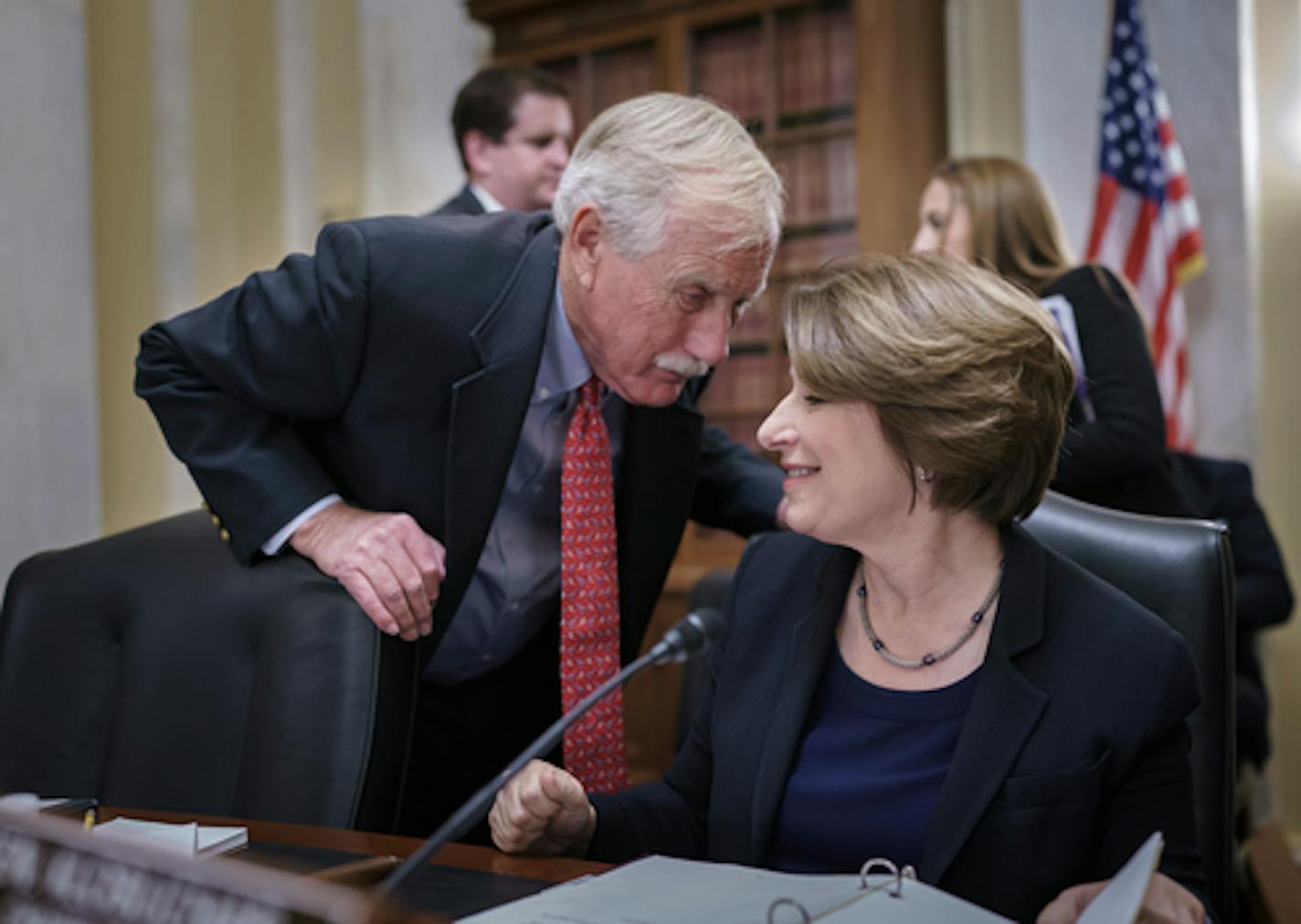 Sen. Angus King, I-Maine, left, confers with Sen. Amy Klobuchar, D-Minn., chair of the Senate Rules Committee, as the panel meets on the Electoral Count Reform and Presidential Transition Improvement Act, at the Capitol in Washington, Tuesday, Sept. 27, 2022. The bill is a response to the Jan. 6 insurrection and former President Donald Trump's efforts to find a way around the Electoral Count Act, the 19th-century law that, along with the Constitution, governs how states and Congress certify electors and declare presidential election winners. (AP Photo/J. Scott Applewhite)