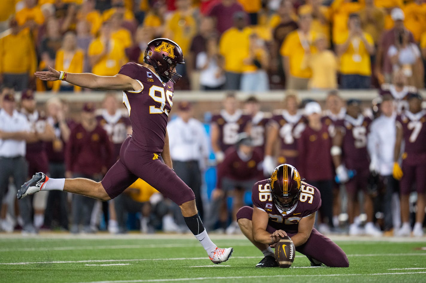 Minnesota Gophers place kicker Dragan Kesich (99) kicks a ball held by punter Mark Crawford (96) for the 47-yard game winning field goal to beat Nebraska 13-10 Thursday, Aug. 31, 2023, at Huntington Bank Stadium in Minneapolis, Minn. ]