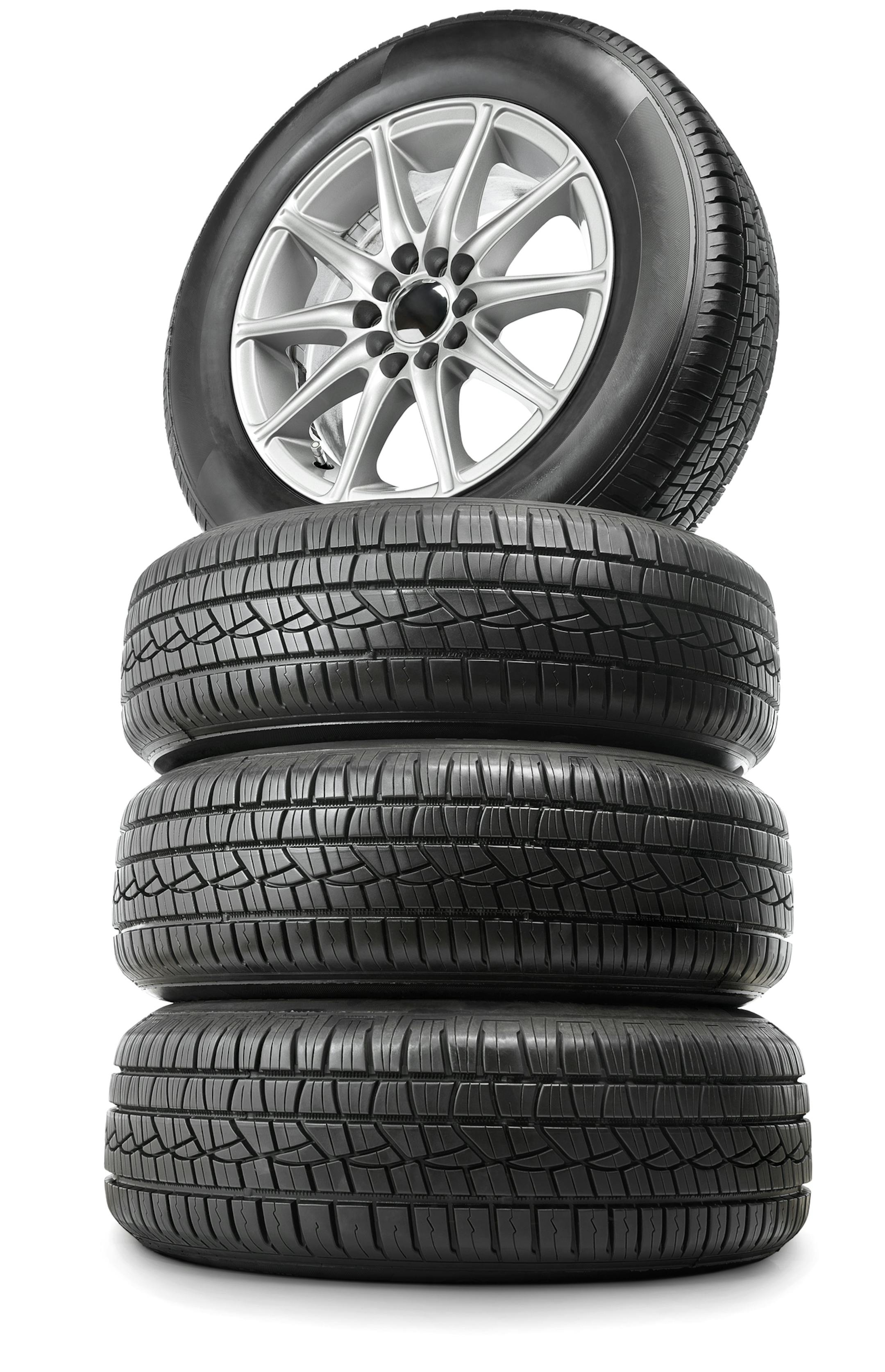 Set of four car wheels and tires. Isolated on white.