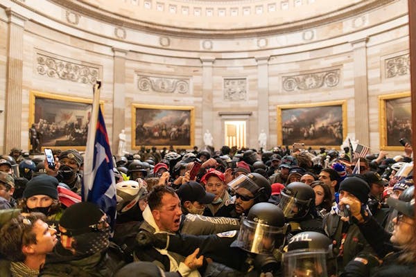 Police tried to hold back supporters of President Donald Trump who breached security and entered the U.S. Capitol building Jan. 6 in Washington D.C.