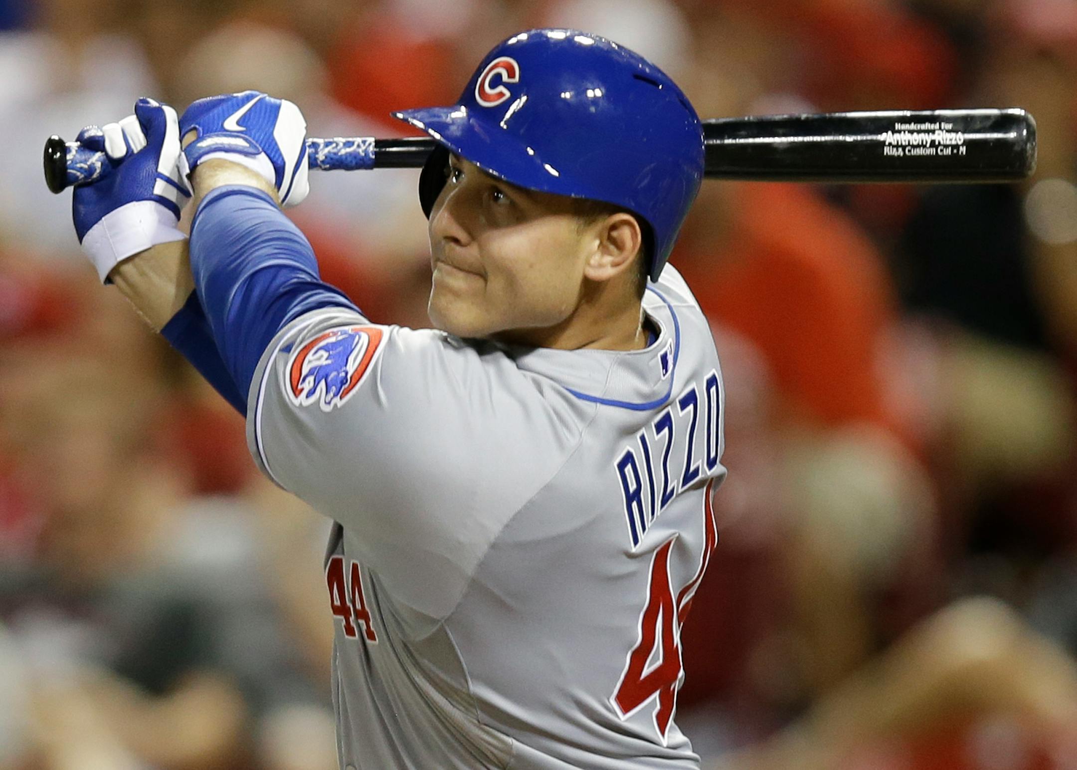 Chicago Cubs' Anthony Rizzo hits a double in the sixth inning of a baseball game against the Cincinnati Reds, Tuesday, July 8, 2014, in Cincinnati. (AP Photo/Al Behrman)