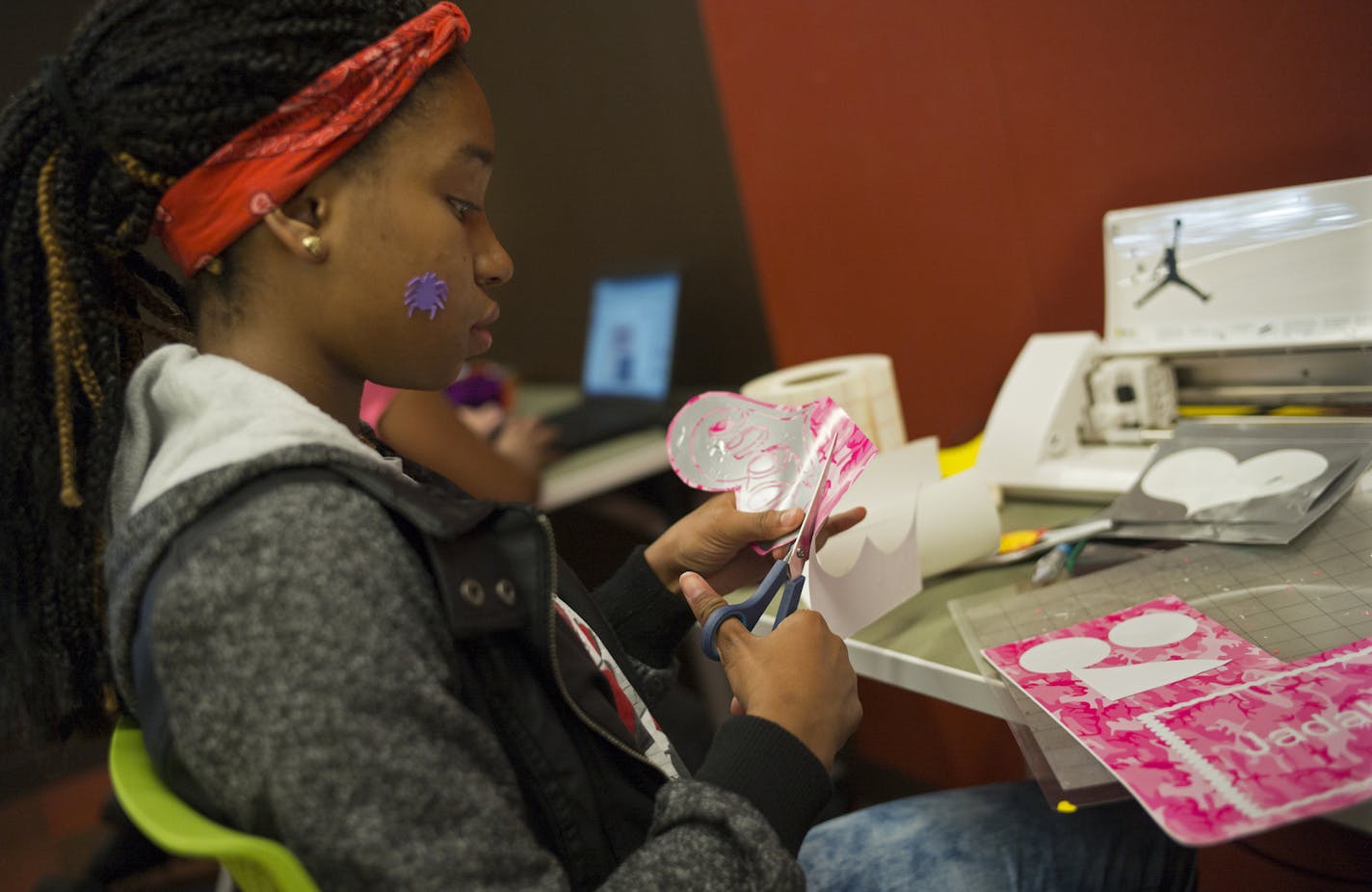 At the Maplewood library, Chanel Coleman,12, was using a computer program and a printer to create custom stickers for herself and friends. ] Richard Tsong-Taatarii/rtsong-taatarii@startribune.com