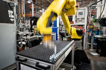 A robot at Graco assembles air hose needle valves at Graco on Feb. 14, 2019, A key manufacturing index slipped into negative territory in Minnesota an