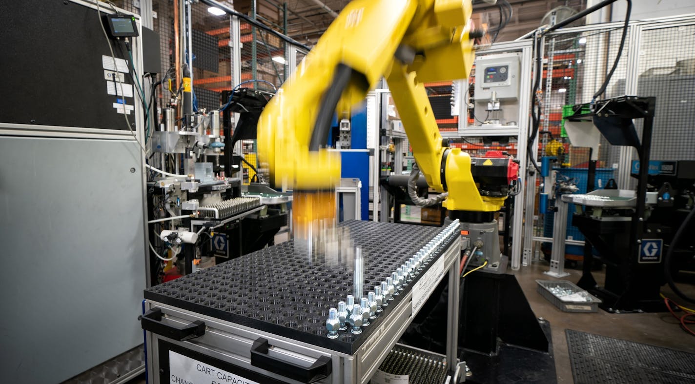 A robot at Graco assembles air hose needle valves at Graco on Feb. 14, 2019, A key manufacturing index slipped into negative territory in Minnesota and the Midwest in August. (Staff photo by Glen Stubbe) ORG XMIT: MIN1902211806060915