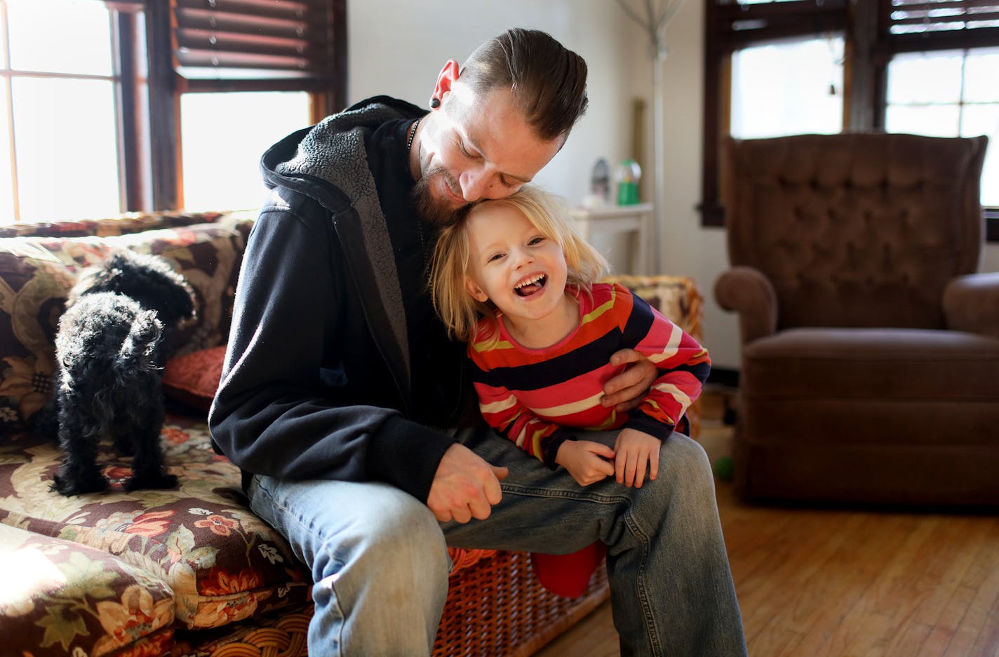 Gabriel Bliss, 31, with his daughter Liberty, 3, is a recovering heroin addict who contracted Hepatitis C from a shared needle. Bliss, seen at the home of his parents where he is living with his wife and daughter, is hoping to to get approved for a new medication that can cure Hepatitis C and was seen Thursday, Jan. 24, 2019, in Richfield, MN.