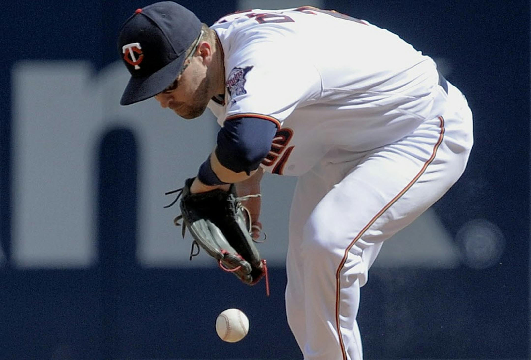 Brian Dozier mishandled a ground ball against the Royals. The play was ruled a hit, but the twins made four errors in Sunday's 11-4 loss.
