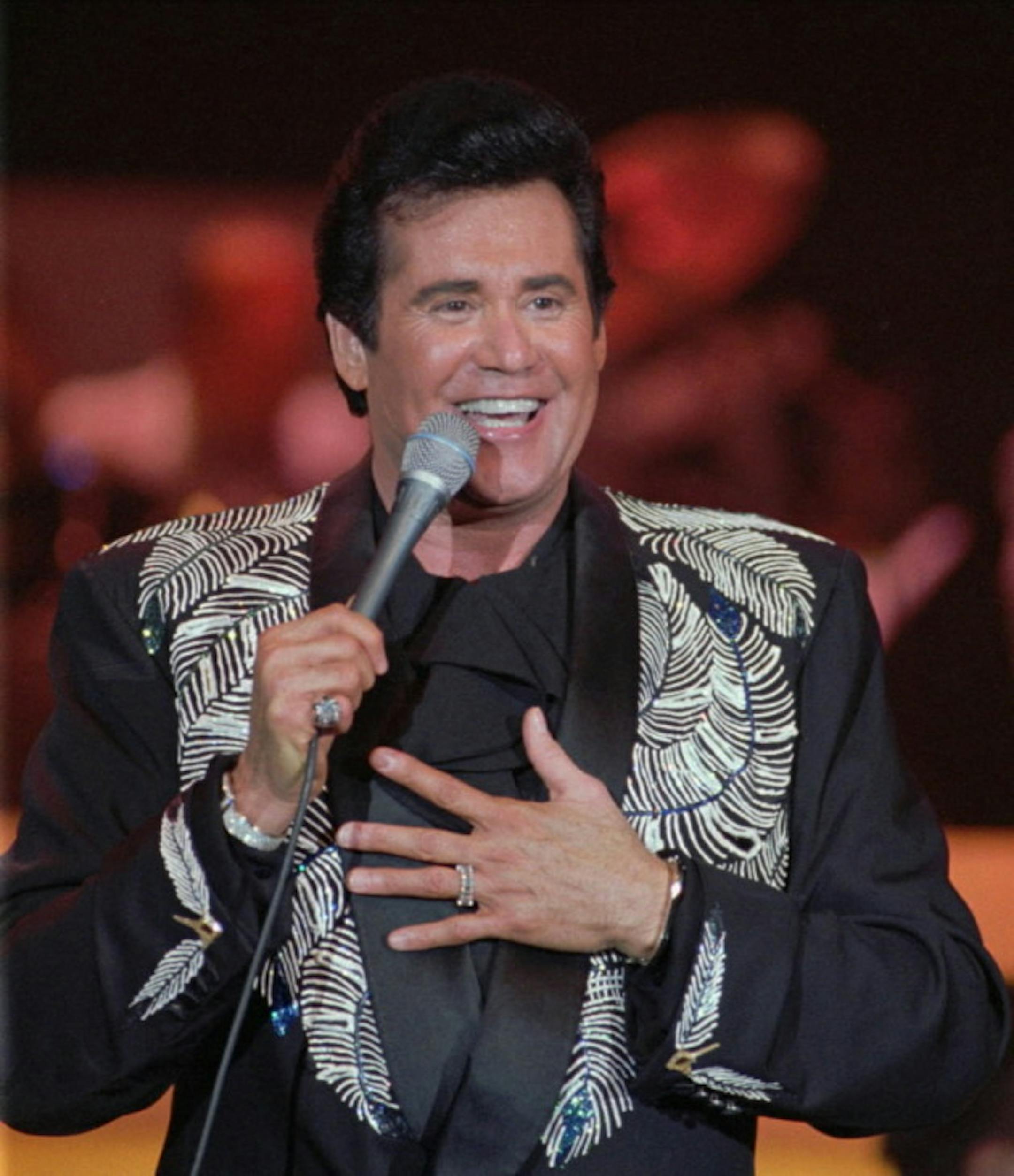 Let's hope Mr. Newton is still smiling come 1 a.m. on Aug. 20. / AP photo by Lennox McLendon