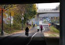 Bicyclists and runners navigated the repaved pathway along the Midtown Greenway in Minneapolis on Nov. 9.