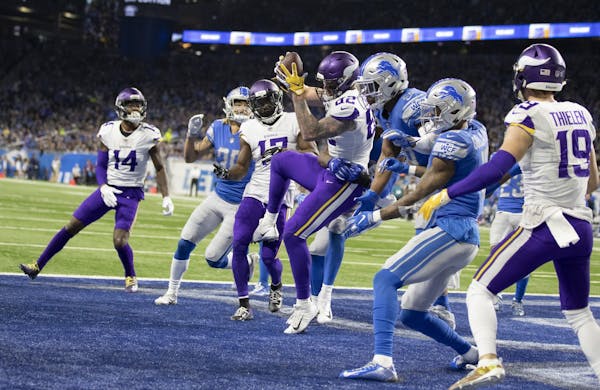 Minnesota Vikings tight end Kyle Rudolph (82) came down with a 44-yard touchdown on the last play of the first half at Ford Field Sunday December 23, 