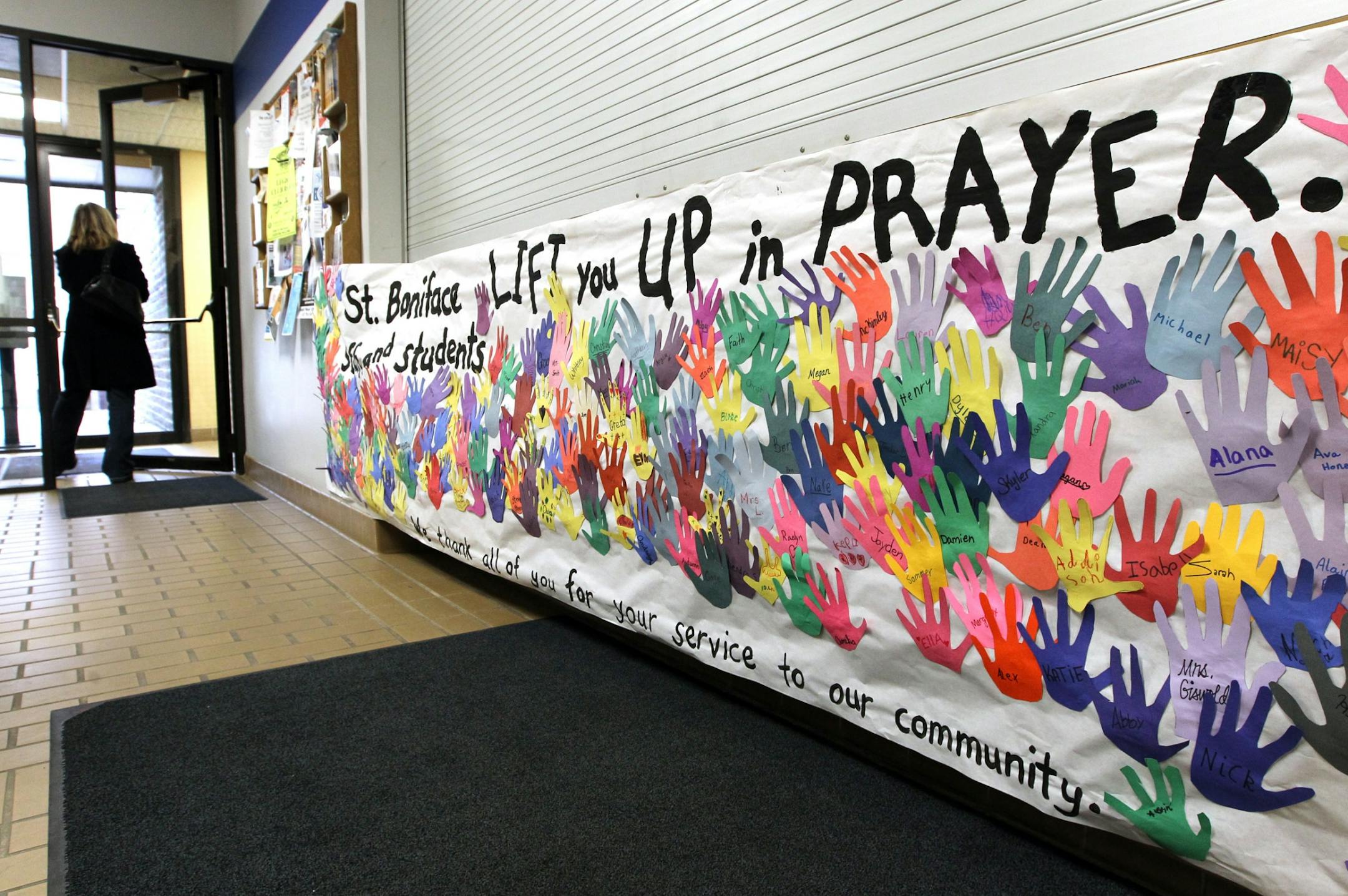 A banner in support of the police department made by students and staff at St. Boniface School hangs outside of the library in Cold Spring after the death of officer Tom Decker December 1, 2012.