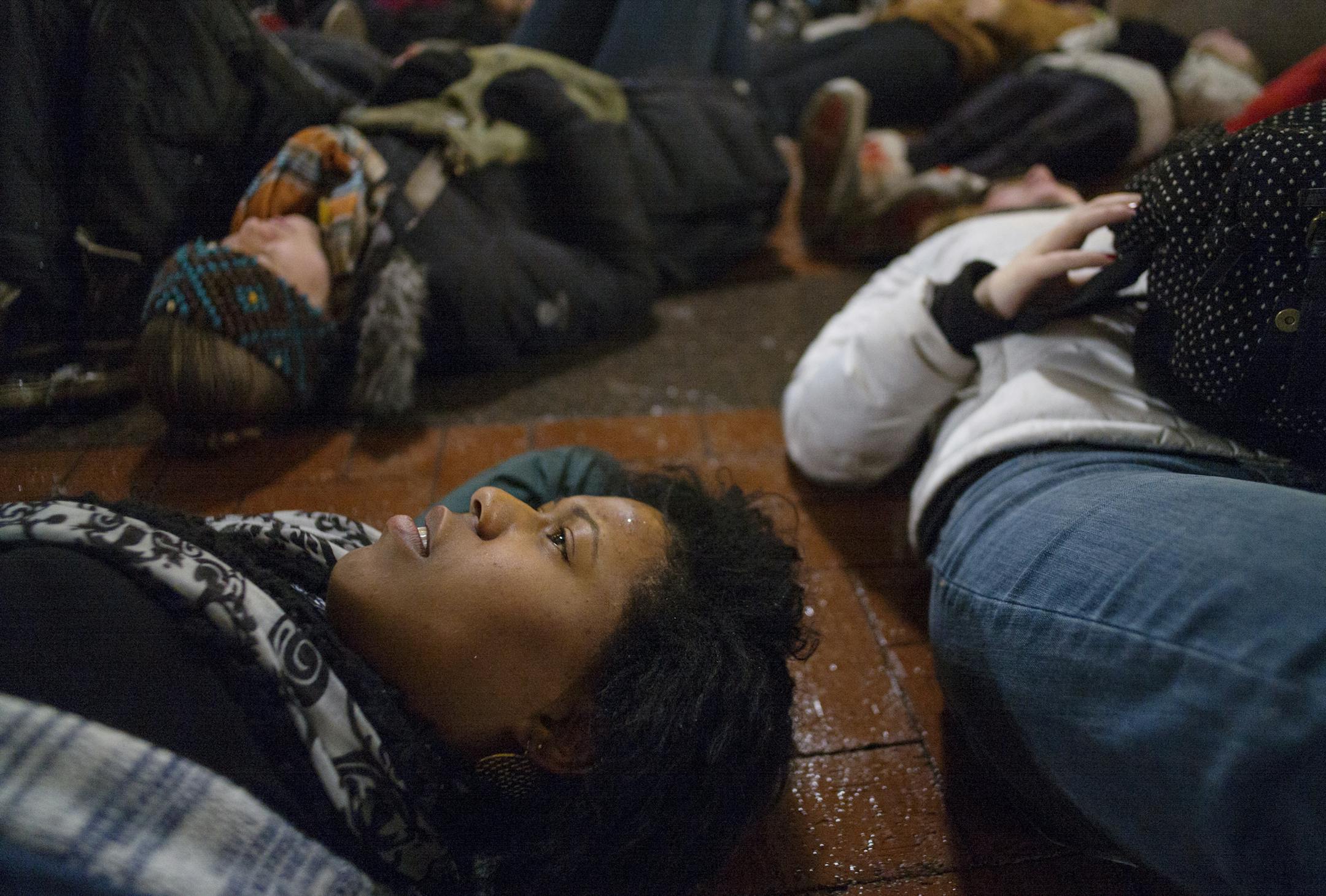 Josheynah Fields, a student at N. Central University participated in the "die in" on Government Plaza.] In downtown Minneapolis, about 150 people turned out to protest police brutality. They marched from the Central Library across the Hennepin Bridge and back to the library across the 3rd Ave Bridge while staging a "die in" at Hennepin County Government Plaza .]Richard Tsong-Taatarii/ rtsong- taatarii@startribune.com