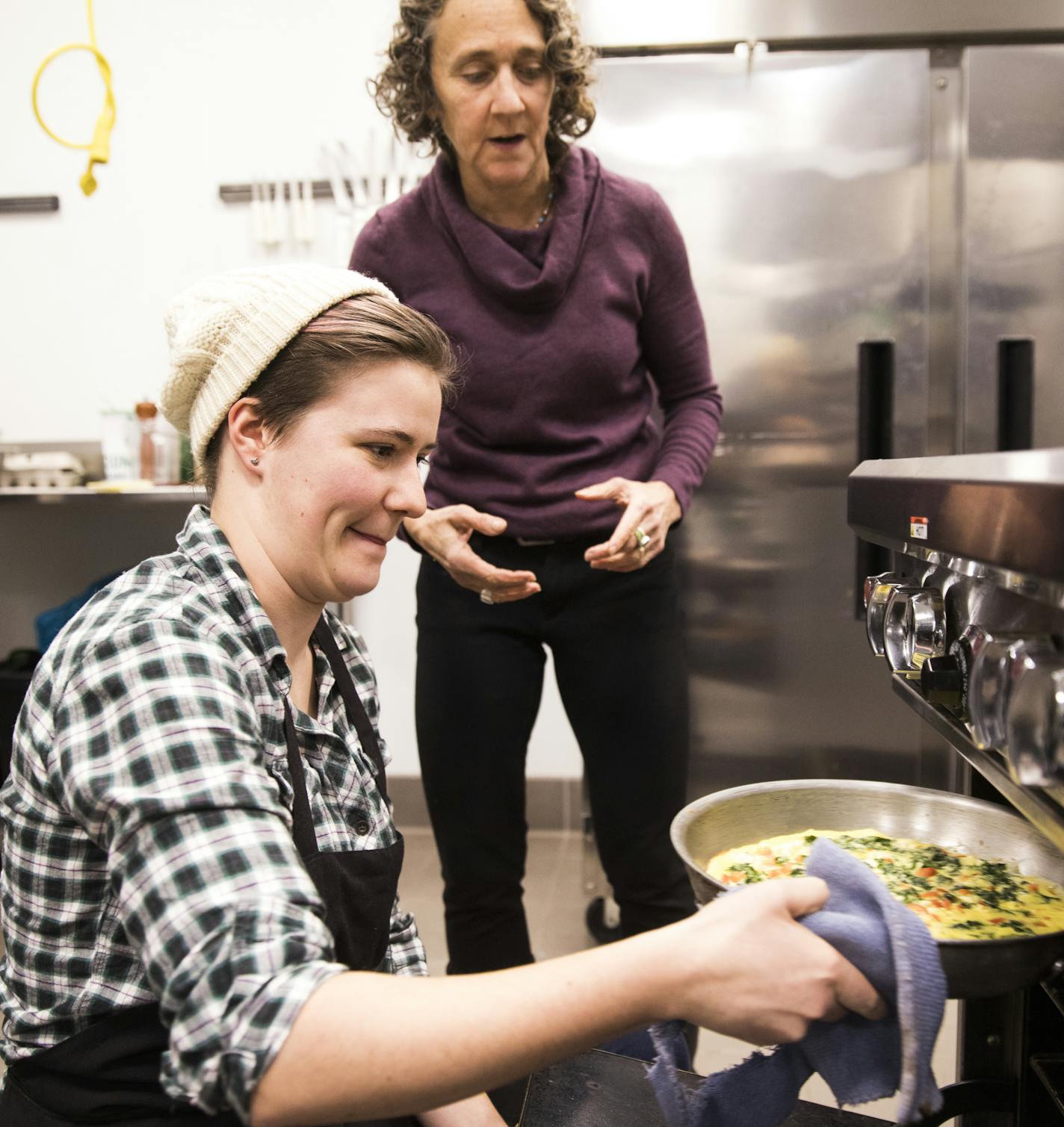 Olivia Beisler, a health coaching graduate student, checked on her frittata in the oven as instructor Jenny Breen looked on. BACKGROUND INFORMATION: Food Matters for Health Professionals class held at the Good Acre's kitchen in Falcon Heights on Wednesday, December 6, 2017. Minnesota students training to be doctors and nurses get an appetizing lesson in good health in a cooking class at the University of Minnesota designed to help them learn how food really is medicine for a bunch of diseases.