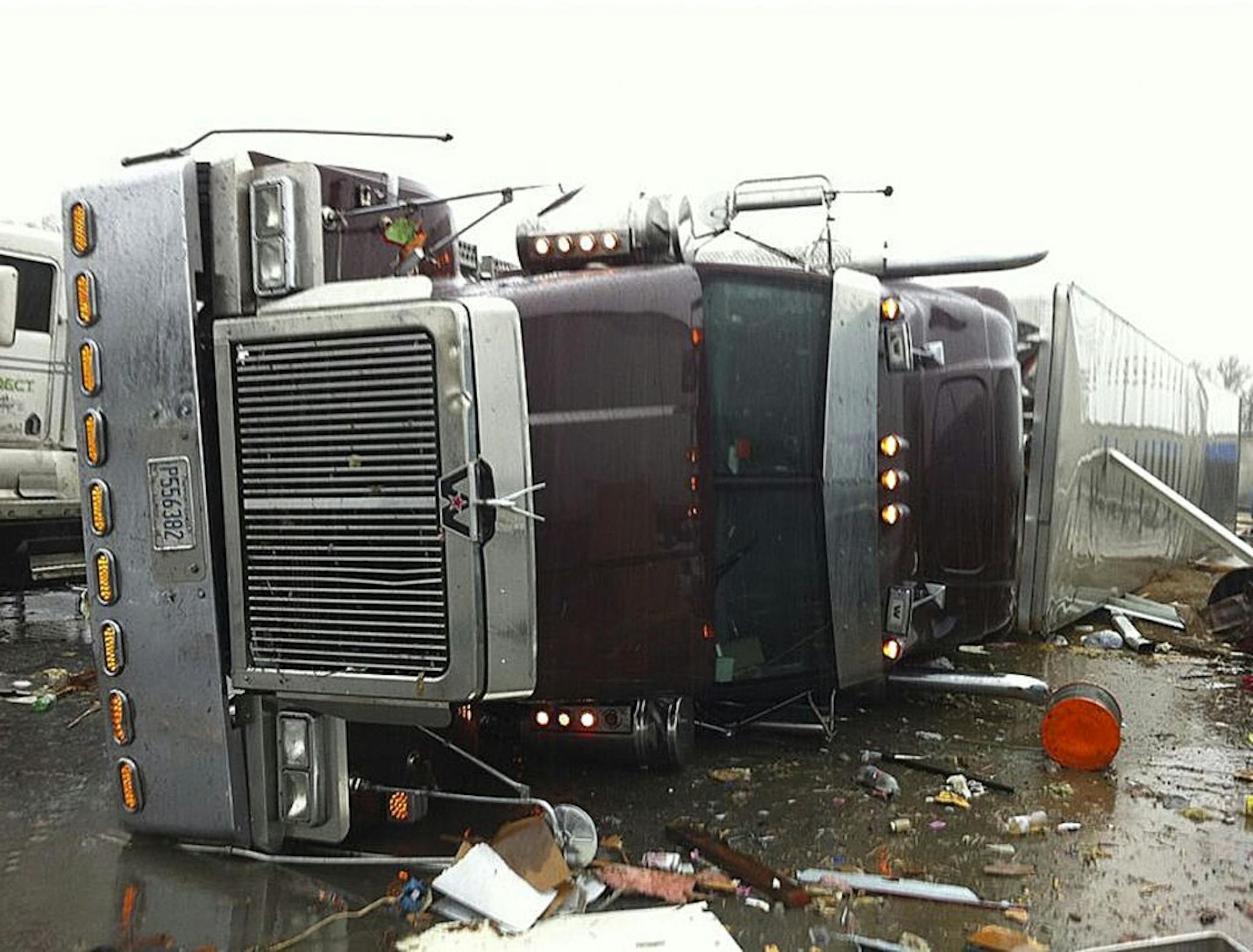 In this image made from video and released by WSB TV in Atlanta, a tractor and trailer rest on the highway after a tornado moved through the town of Adairsville, Ga. on Wednesday, Jan 30, 2013. A fire chief says a storm that roared across northwest Georgia has left overturned vehicles on Interstate 75 northwest of Atlanta, and crews are responding to reports of people trapped in storm-damaged residential and commercial buildings. (AP Photo/WSB TV) MANDATORY CREDIT