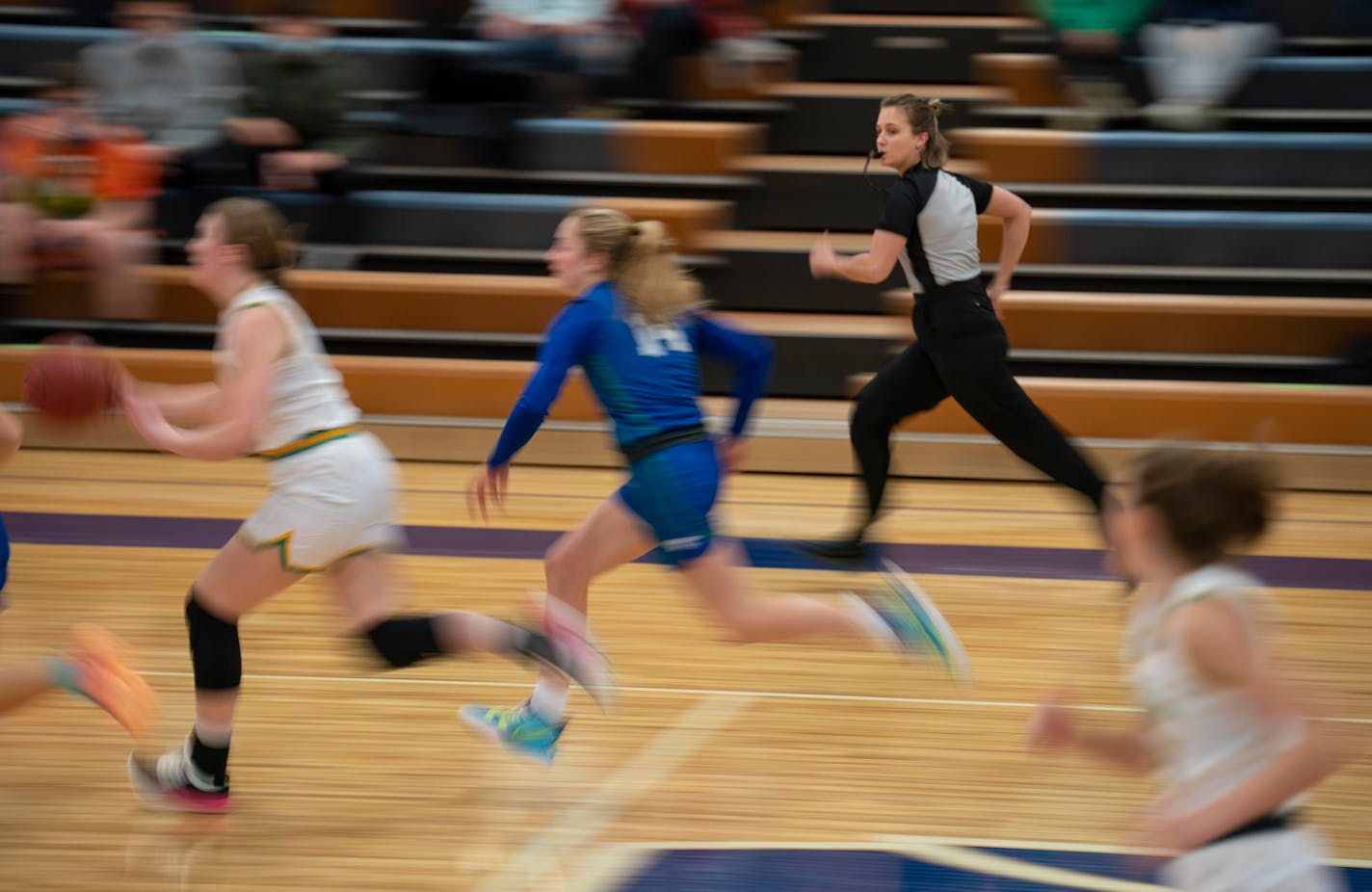 Leah Johnson kept pace with a fast break while officiating the first half of the Edina vs. Eagan girl's varsity game at Eagan High School Monday night, Jan. 10, 2022 in Eagan, Minn. An all-woman crew of Leah Johnson, Macy Madsen, and Dayna Rethlake officiated the basketball game between Edina and Eagan High Schools. ] JEFF WHEELER • Jeff.Wheeler@startribune.com