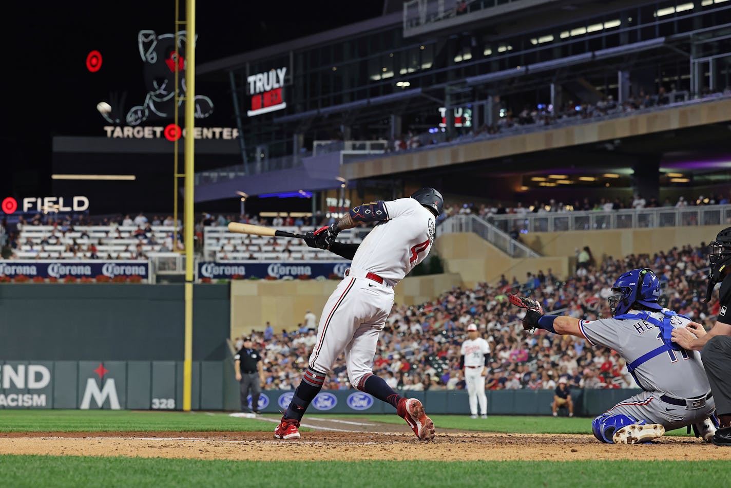 Minnesota Twins' Carlos Correa hits a home run during the seventh inning of a baseball game against the Texas Rangers, Friday, Aug. 25, 2023, in Minneapolis. Minnesota won 12-2. (AP Photo/Stacy Bengs)