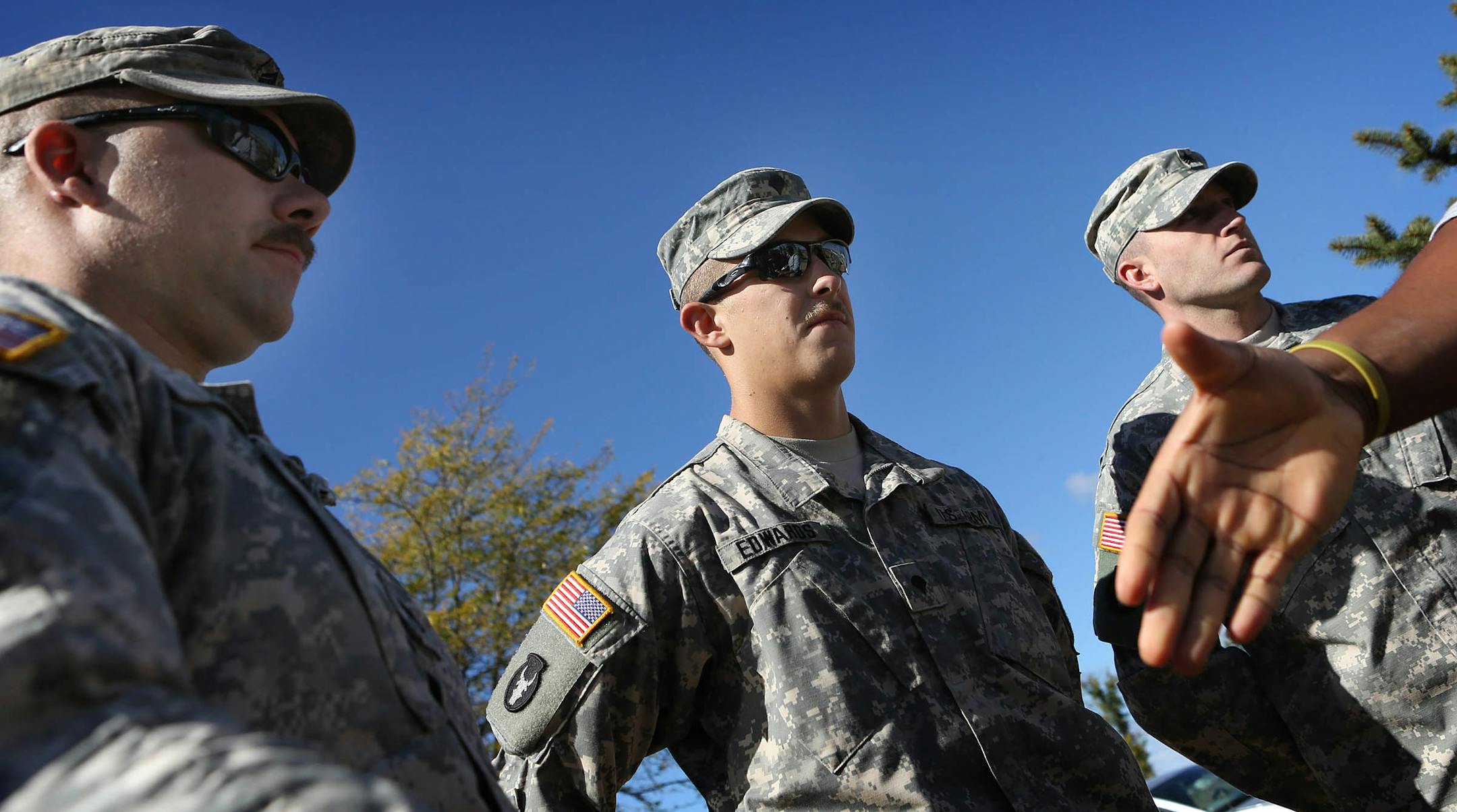 Staff Sgt. Nicholas Purkat, Specialist Christopher Edwards and Sgt. Shawn Schmidt were awarded the Soldiers Medal for heroism Saturday at Camp Ripley by Undersecretary of the Army Joseph Westphal and commander Col. Eric Kerska.