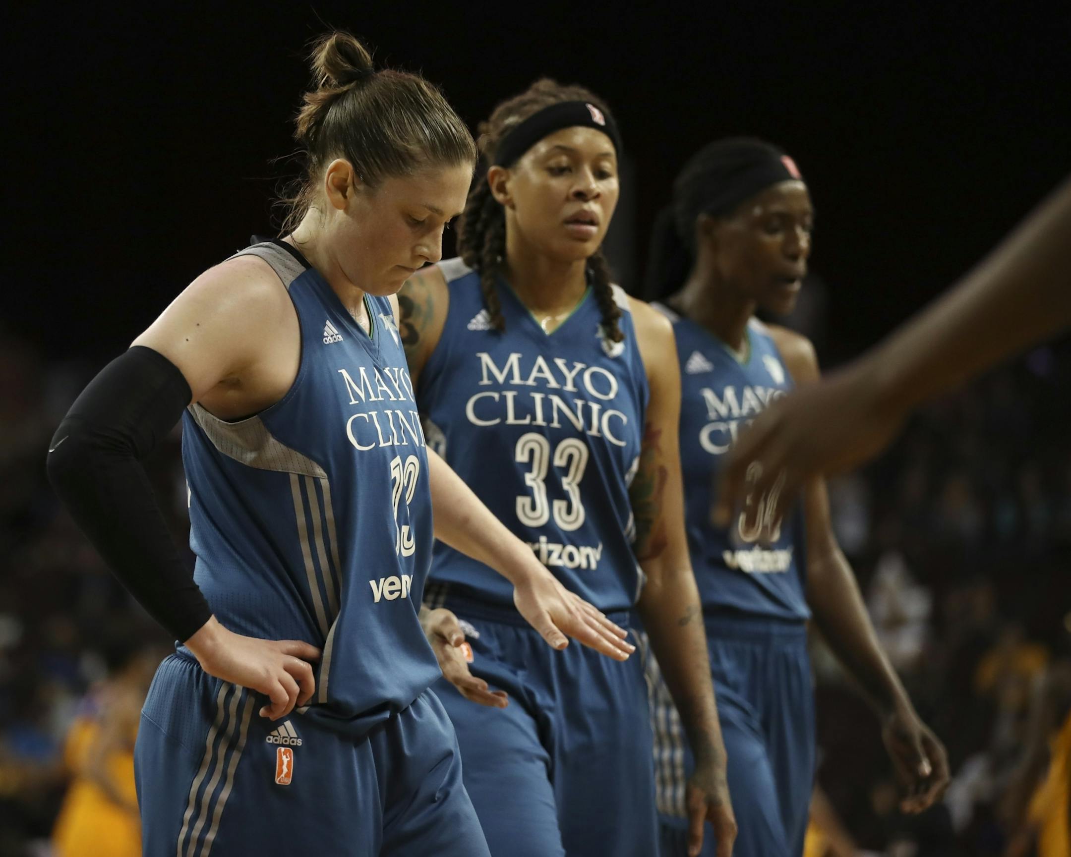 Minnesota Lynx guards Lindsay Whalen (13), Seimone Augustus (33) and center Sylvia Fowles (34) went to bench for a time out trailing the Sparks by a wide margin in the fourth quarter.