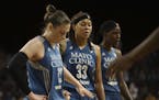 Minnesota Lynx guards Lindsay Whalen (13), Seimone Augustus (33) and center Sylvia Fowles (34) went to bench for a time out trailing the Sparks by a w