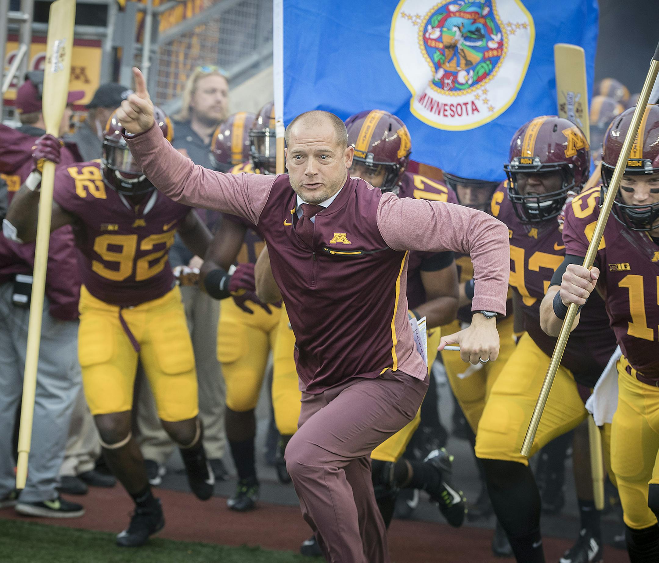 Minnesota's Head Coach P. J. Fleck led his team onto the field before the Gophers took on Illinois at TCF Bank Stadium, Saturday, October 21, 2017 in Minneapolis, MN. ] ELIZABETH FLORES &#xef; liz.flores@startribune.com