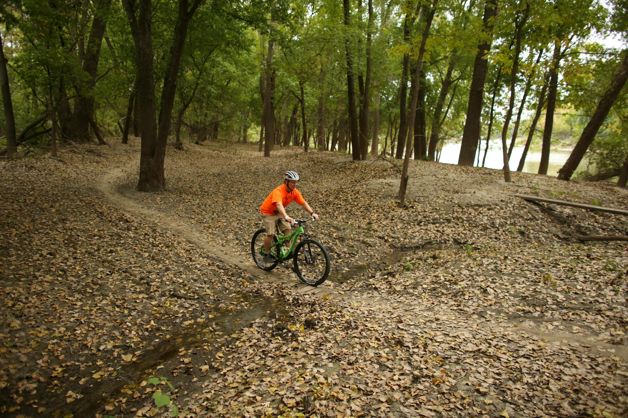 Dennis Porter on a mountain bike trail along the Minnesota River Wednesday afternoon in Bloomington. ] JEFF WHEELER • jeff.wheeler@startribune.com The Minnesota DNR wants to spend more than $13 million to create a paved trail through the Minnesota National Wildlife Refuge, an area popular with mountain bikers. Bikers, such as Dennis Porter of Bloomington, argue that there are already plenty of paved trails in the Twin Cities and besides, the area is routinely flooded with sand and debris left be