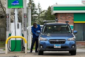 FILE - A customer stops for fuel at a gas station in Northbrook, Ill., on April 18, 2024. Gas prices are once again on the decline across the U.S. —