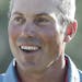 Matt Kuchar smiles as he walks off the 18th hole during the final round of the Masters golf tournament, Sunday, April 9, 2017, in Augusta, Ga. (AP Pho
