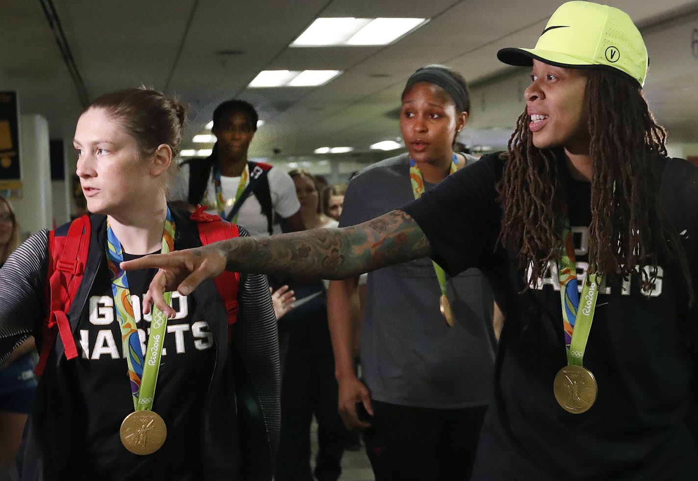 Lynx players, from left, Lindsay Whalen, Sylvia Fowles, Maya Moore and Seimone Augustus were caught off guard by their reception at MSP International Airport on Monday night.