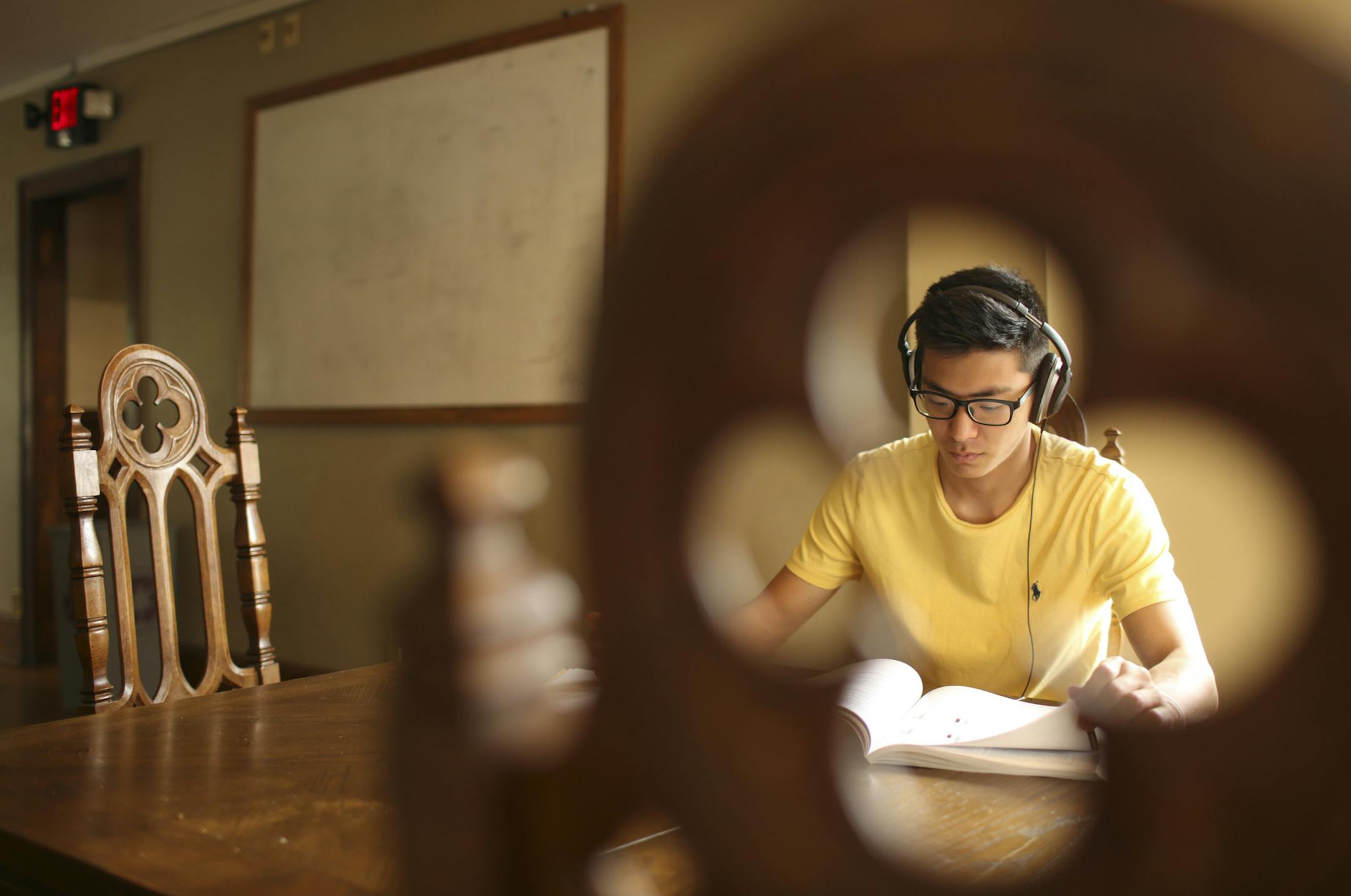Jung Lee studied for the MCAT in the dining room of the Delta Chi fraternity house Monday afternoon. The fraternity members would like to open up a pass through counter to the kitchen where the white board is in the background. JEFF WHEELER ï jeff.wheeler@startribune.com The University of Minnesota has created a loan program to assist fraternities and sororities that want to fix up their aging properties. Delta Chi is among several fraternities on frat row that are having renovations done n