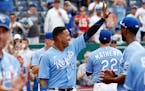 Kansas City Royals' Salvador Perez (13) and other players thank their fans at the end of their last baseball game of the season, against the Minnesota