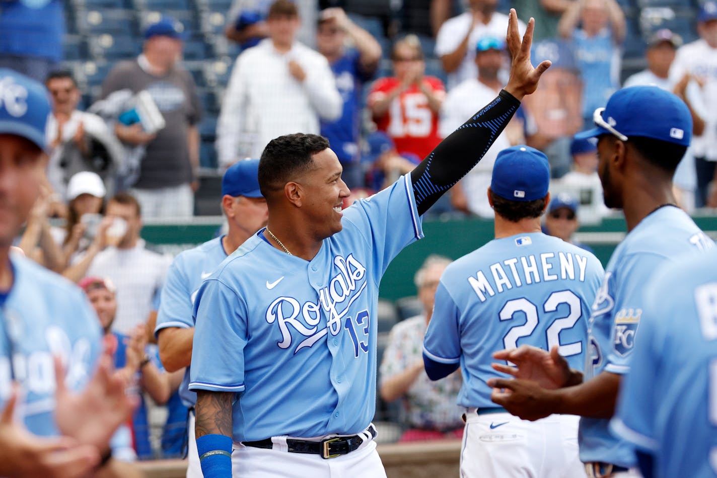 Kansas City Royals' Salvador Perez (13) and other players thank their fans at the end of their last baseball game of the season, against the Minnesota Twins, in Kansas City, Mo., Sunday, Oct. 3, 2021. (AP Photo/Colin E. Braley)