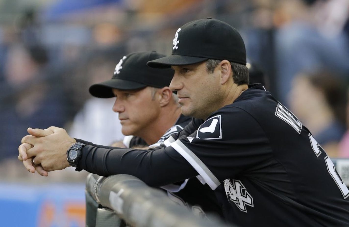 Chicago White Sox manager Robin Ventura, right, and third base coach Joe McEwing watch during the first inning of the second baseball game of a doubleheader against the Minnesota Twins in Chicago, Friday, Aug. 9. 2013. The Twins won 3-2.