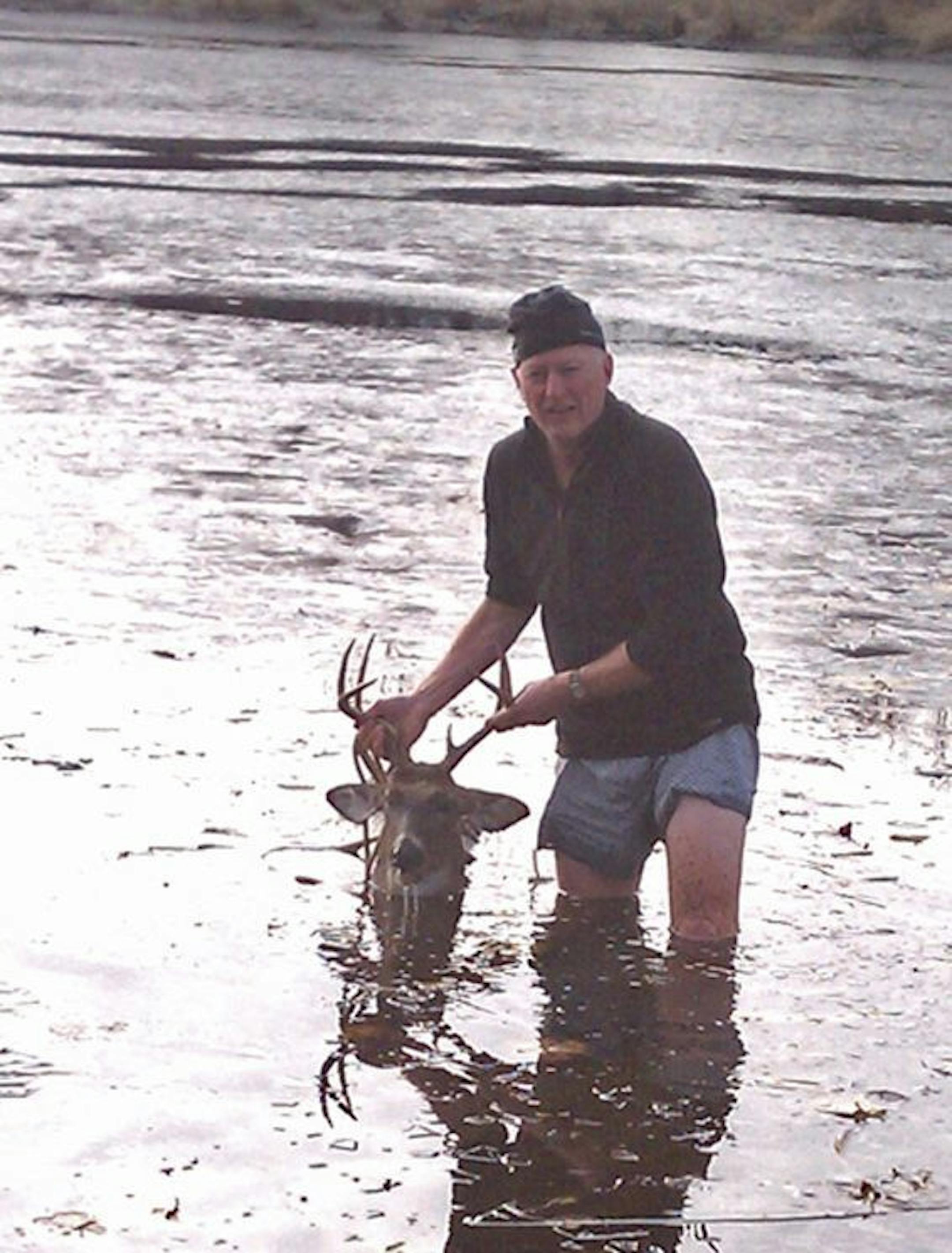 Mitch Berg of Mendota Heights was bow hunting in Wisconsin when he arrowed this dandy buck, which detoured onto a frozen lake,where it died and broke though the ice. With no waders nearby, and fearing the animal might sink from sight, Berg striped to his shorts and waded in after his deer.