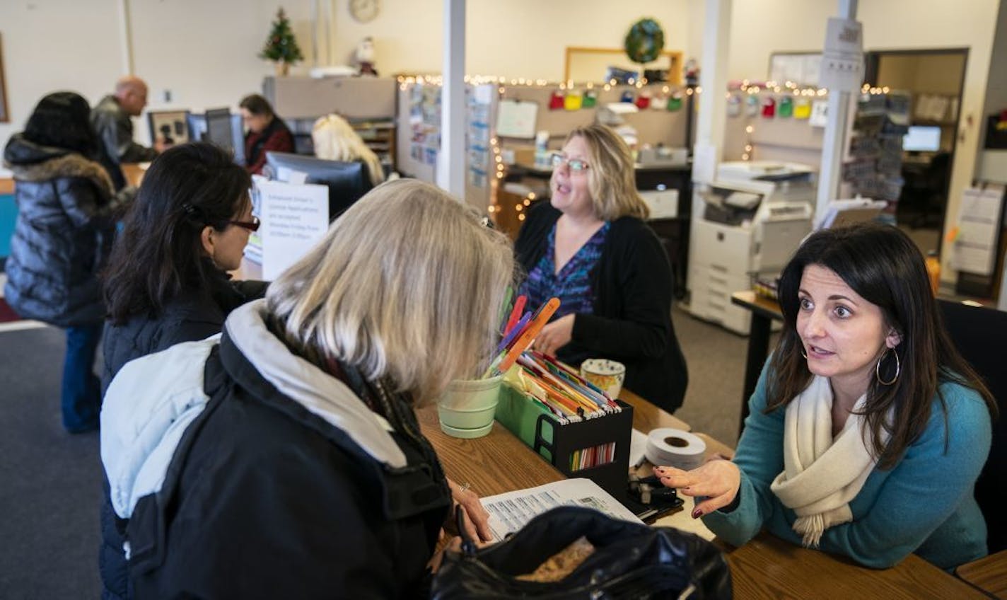 Motor vehicle supervisor Tereza Bazac helps a customer at the Roseville License Center.