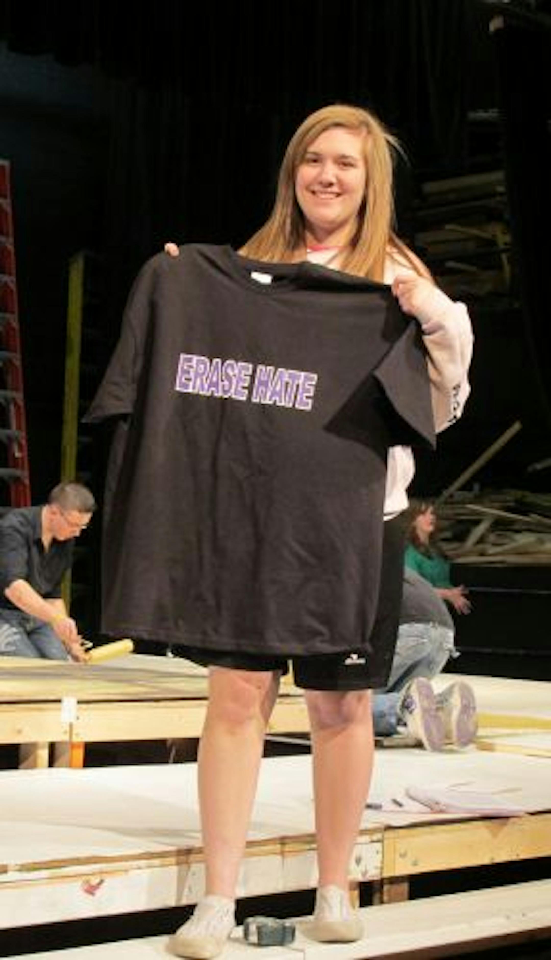Provided photo
Actress Nicole Lamm holds one of the �Erase Hate� t-shirts that will be sold at performances of �The Laramie Project�