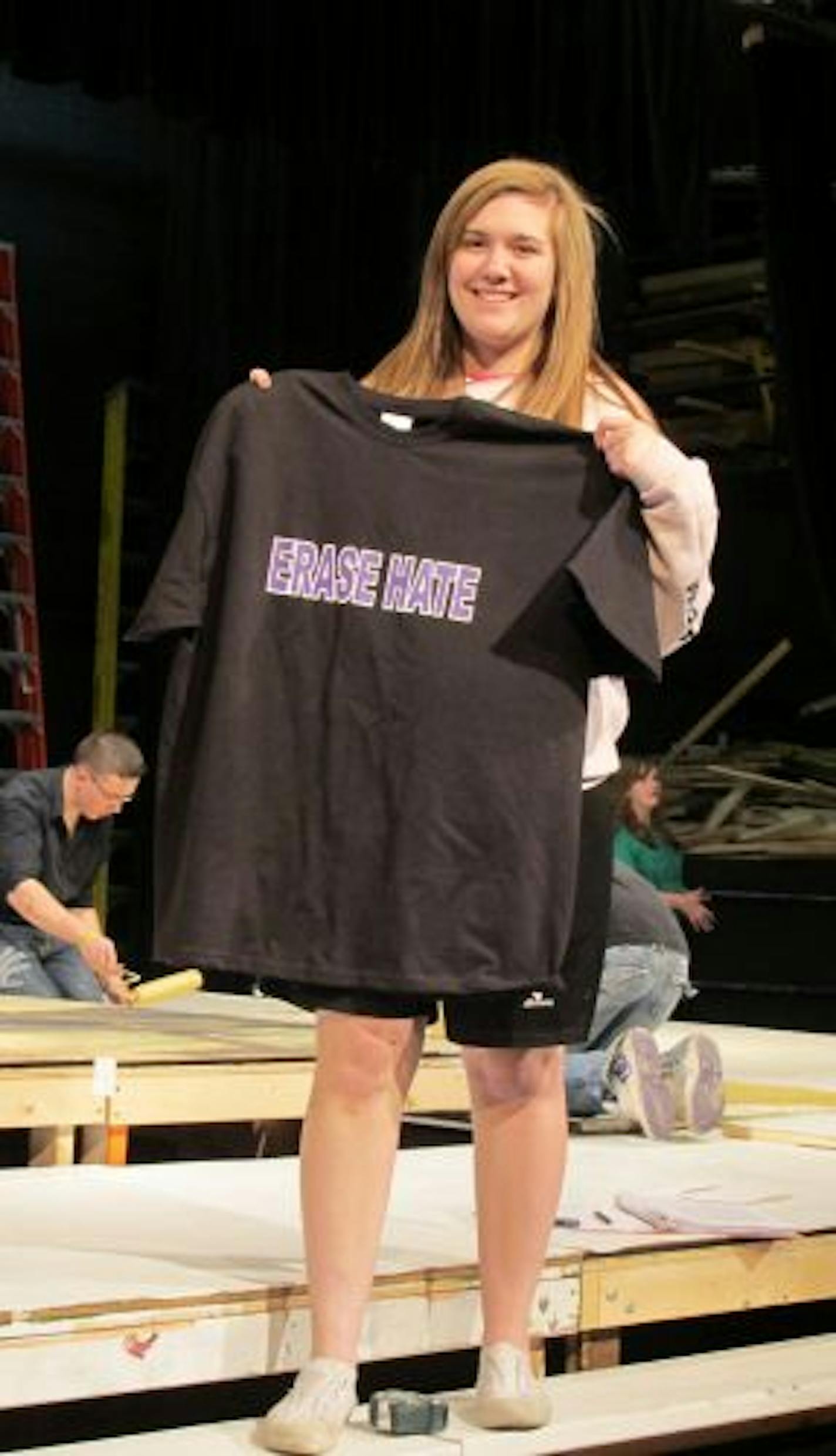 Provided photo
Actress Nicole Lamm holds one of the �Erase Hate� t-shirts that will be sold at performances of �The Laramie Project�