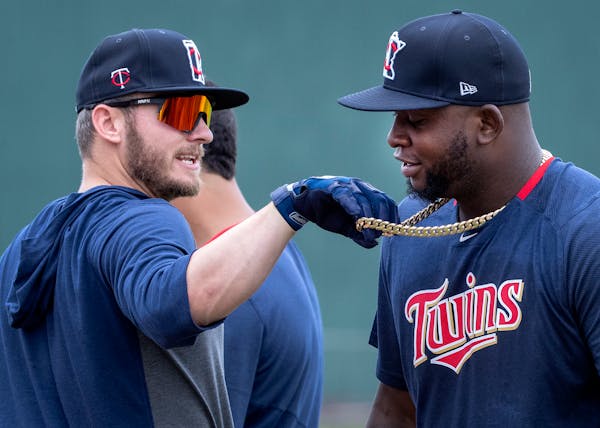 Minnesota Twins Josh Donaldson adjusted the necklace of Miguel Sano during batting practice.