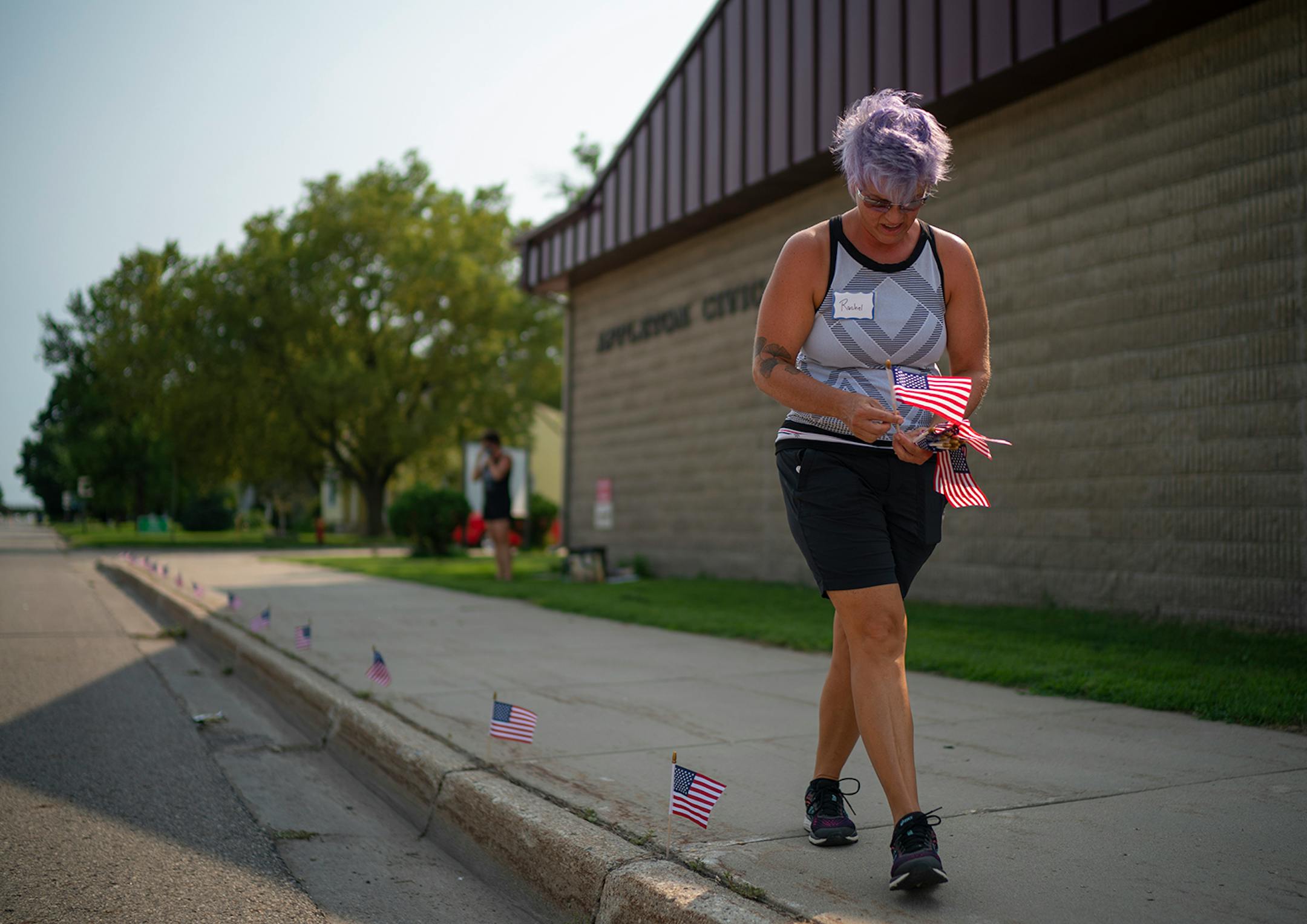 Rachel Rigenhagen, the founder of the Appleton Community Diversity Coalition (ACDC) Facebook group, arrived early to place flags along West Schlieman Ave. outside the City Offices before the weekly demonstration.