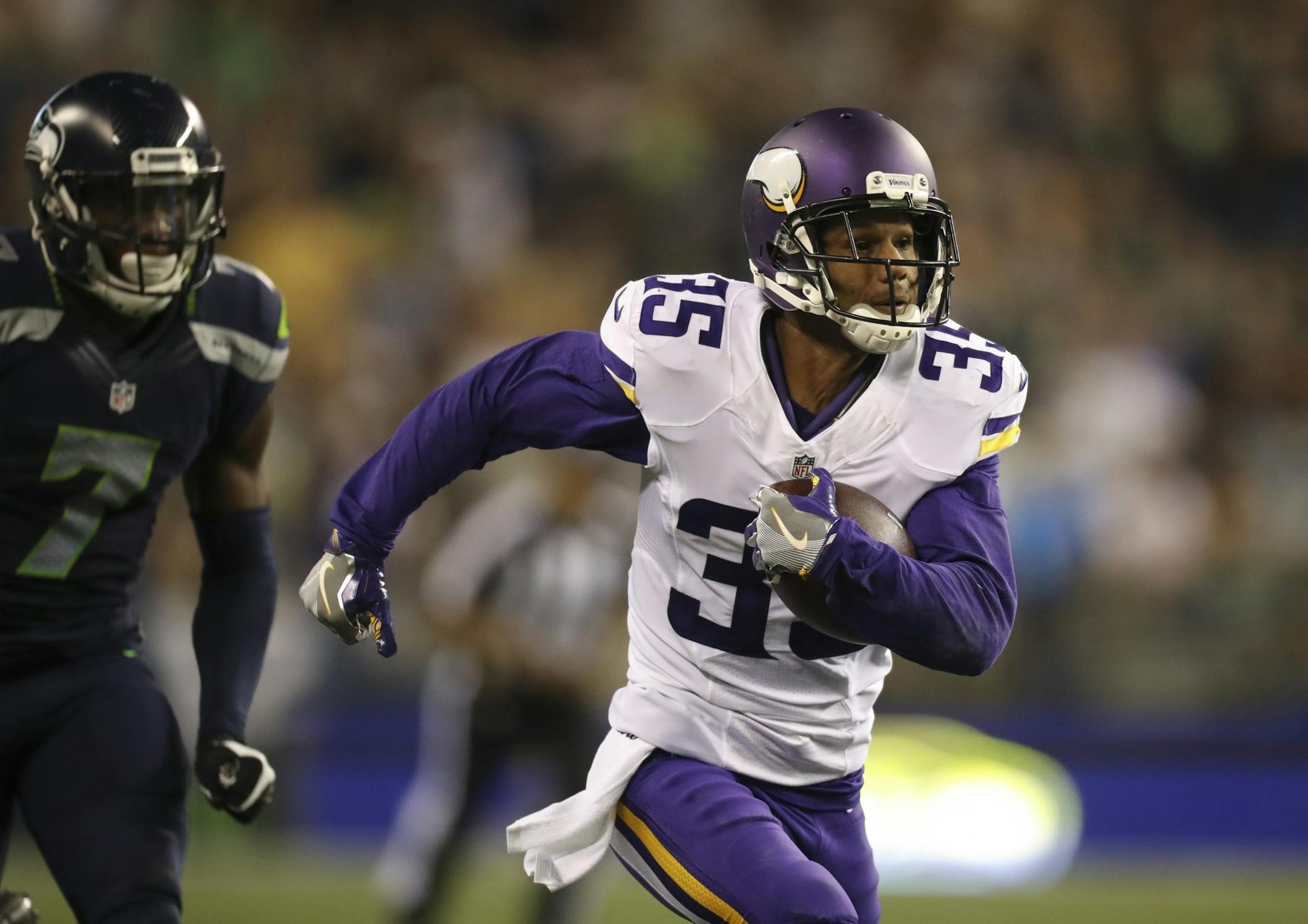 With the score tied, Vikings cornerback Marcus Sherels (35) intercepted a fourth quarter pass intended for Seattle's E.Z. Nwachukwu and returned it 53 yards for the game winning touchdown Thursday night.