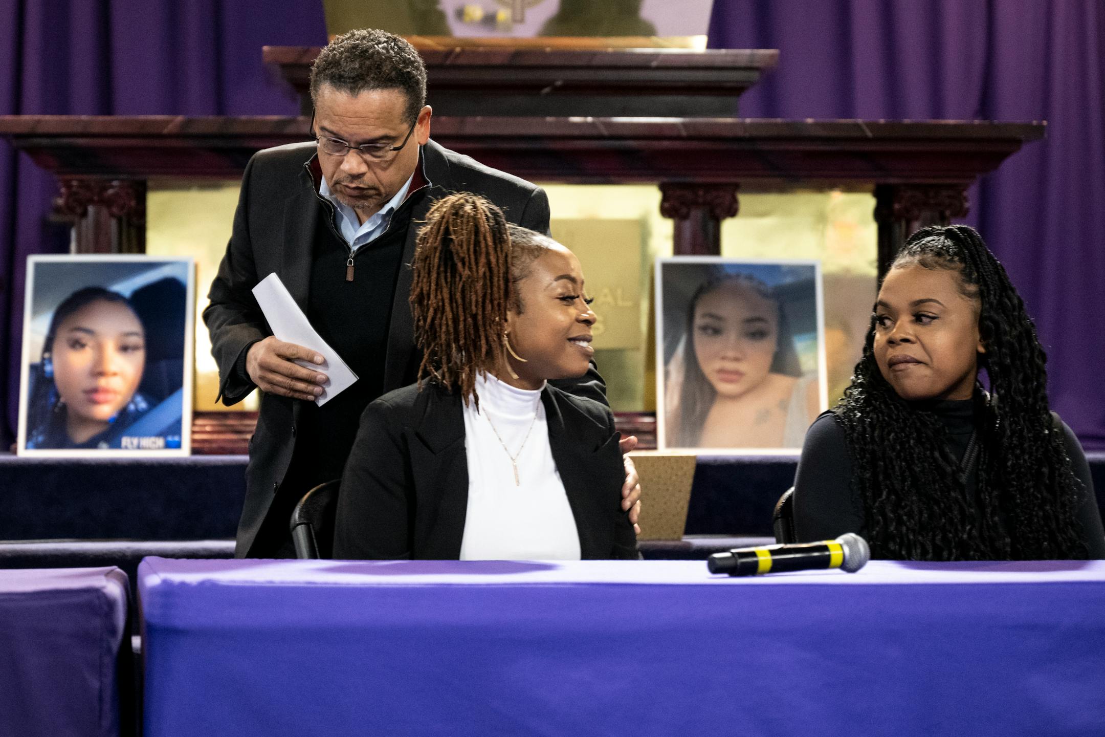 Minnesota Attorney General Keith Ellison pats the shoulder of Tiffynnie Epps, sister of Zaria McKeever, after Ellison gave remarks at Shiloh Temple in Minneapolis. At right is McKeever's cousin, Shontell Bishop.