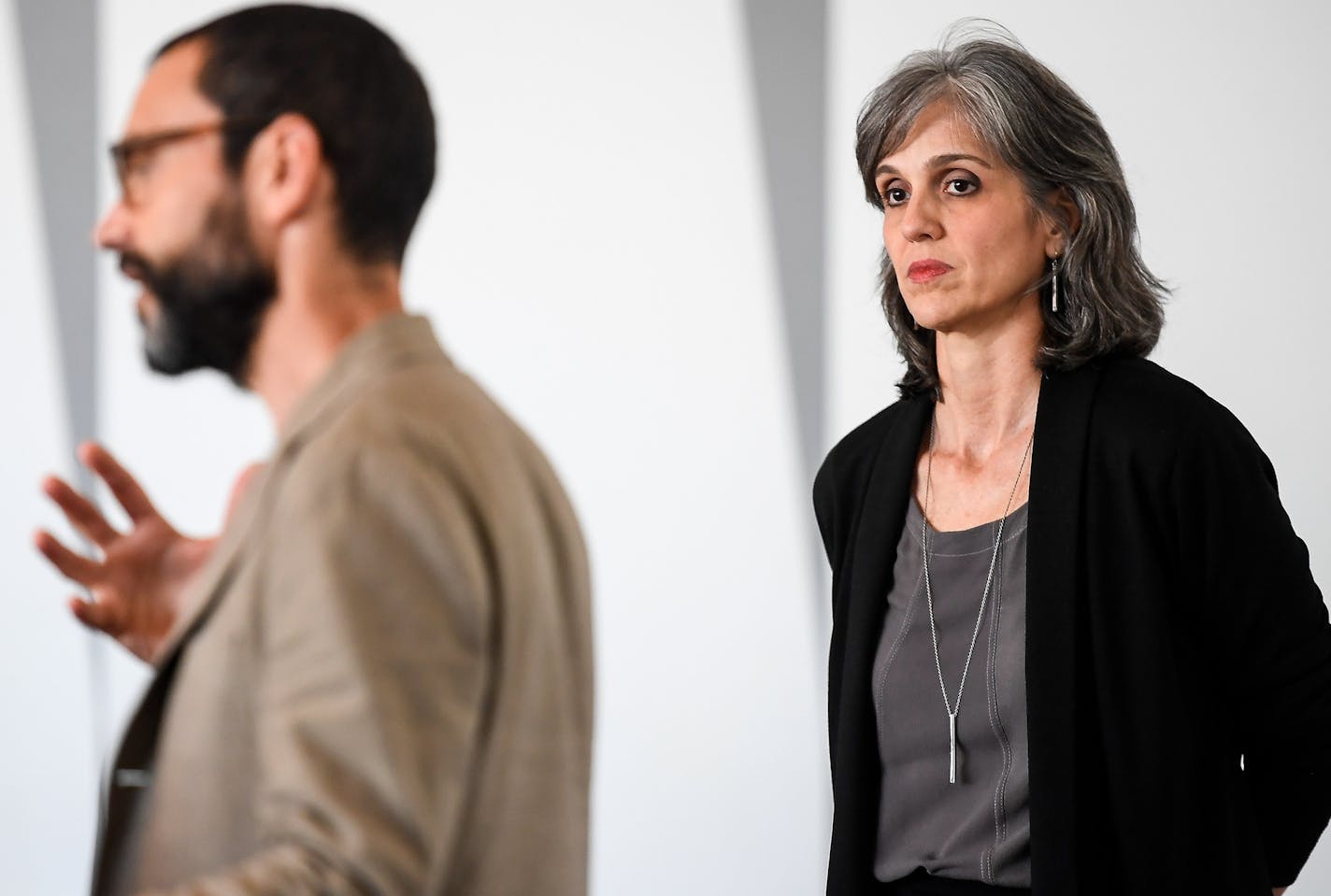 Walker Art Center director Olga Viso watched as Sam Durant, the artist behind the "Scaffold" sculpture, spoke during a Q&A on May 31.